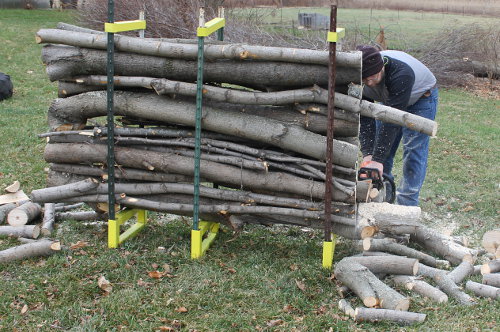 First cut through the firewood is complete.