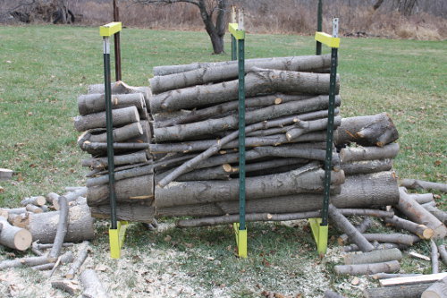 The second cut through the firewood is complete.