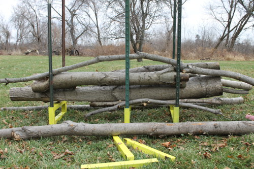 Stack branches in Firewood Cutting Rack for firewood