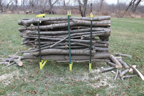 Trim the ends of the branches for firewood.